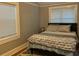 Bedroom with double bed, neutral walls, and window blinds at 1003 W Mahoney St, Plant City, FL 33563