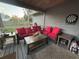 Cozy screened porch with comfortable seating and a dartboard at 1003 W Mahoney St, Plant City, FL 33563