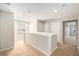 Upstairs hallway with carpeted floor and doors to bedrooms at 10236 Newminster Loop, Ruskin, FL 33573