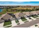 Community view showing row of homes near a lake at 18027 Turning Leaf Cir, Land O Lakes, FL 34638