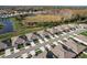 Aerial view of a neighborhood with lakefront property at 18027 Turning Leaf Cir, Land O Lakes, FL 34638