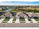 Community view showing homes, landscaping and lake at 18027 Turning Leaf Cir, Land O Lakes, FL 34638