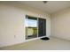 Patio with sliding glass doors leading to backyard at 18027 Turning Leaf Cir, Land O Lakes, FL 34638