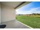 Covered patio with view of backyard and neighboring houses at 18027 Turning Leaf Cir, Land O Lakes, FL 34638