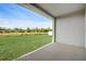 Covered patio overlooking a spacious backyard at 18027 Turning Leaf Cir, Land O Lakes, FL 34638