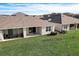 Two homes with covered patios and fenced yards at 18027 Turning Leaf Cir, Land O Lakes, FL 34638