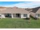 Home with covered patio and spacious backyard at 18027 Turning Leaf Cir, Land O Lakes, FL 34638