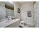 Clean bathroom with a shower/tub combo and white vanity at 18027 Turning Leaf Cir, Land O Lakes, FL 34638