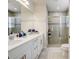 Elegant bathroom with double vanity, large shower, and modern fixtures at 18027 Turning Leaf Cir, Land O Lakes, FL 34638