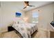 Cozy bedroom with a queen-size bed and a ceiling fan at 18027 Turning Leaf Cir, Land O Lakes, FL 34638