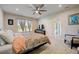 Spacious bedroom with a king-size bed and ensuite bathroom access at 18027 Turning Leaf Cir, Land O Lakes, FL 34638