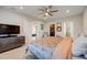 Bright bedroom featuring a king-size bed, ample closet space, and a TV at 18027 Turning Leaf Cir, Land O Lakes, FL 34638