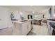 Modern kitchen features white cabinets and stainless steel appliances at 18027 Turning Leaf Cir, Land O Lakes, FL 34638
