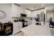 Modern kitchen with white cabinets and stainless steel appliances at 18027 Turning Leaf Cir, Land O Lakes, FL 34638