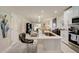 Open kitchen boasts an island with seating and stainless steel appliances at 18027 Turning Leaf Cir, Land O Lakes, FL 34638