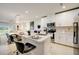 Modern kitchen with white cabinets, stainless steel appliances, and an island at 18027 Turning Leaf Cir, Land O Lakes, FL 34638