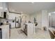 Modern kitchen with white cabinets, stainless steel appliances, and an island at 18027 Turning Leaf Cir, Land O Lakes, FL 34638