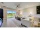 Living area with sliding glass doors leading to the backyard and featuring comfy seating at 18027 Turning Leaf Cir, Land O Lakes, FL 34638