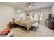 Large main bedroom with king bed, stylish decor, and large windows at 18027 Turning Leaf Cir, Land O Lakes, FL 34638