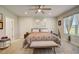Spacious Primary bedroom with a king-size bed and ample natural light at 18027 Turning Leaf Cir, Land O Lakes, FL 34638