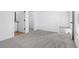 Spacious bedroom with grey carpet and ample closet space at 29658 Fedora Cir, Brooksville, FL 34602