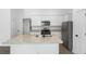 Modern kitchen with granite island and stainless steel appliances at 29658 Fedora Cir, Brooksville, FL 34602