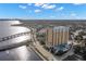 Stunning aerial view of the condominium building and surrounding cityscape with water views at 345 Bayshore Blvd # 308, Tampa, FL 33606