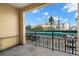 The balcony has black iron railings and a view of a cityscape under a bright sky at 345 Bayshore Blvd # 308, Tampa, FL 33606