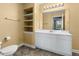 Bathroom with a toilet and sink, featuring ample shelving and clean white cabinetry at 345 Bayshore Blvd # 308, Tampa, FL 33606