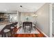 Bright dining area featuring wood floors, modern lighting, and an adjacent kitchen bar at 345 Bayshore Blvd # 308, Tampa, FL 33606