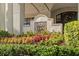 Building sign with address '345 Bayshore' is surrounded by vibrant and lush greenery at 345 Bayshore Blvd # 308, Tampa, FL 33606