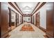 A long hallway features marble flooring and multiple doorways, enhanced by recessed lighting at 345 Bayshore Blvd # 308, Tampa, FL 33606