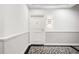 This hallway features white walls with white chair rail and an ornate patterned rug at 345 Bayshore Blvd # 308, Tampa, FL 33606