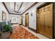 Hallway featuring golden elevator doors, and a red marble floor, lit by a chandelier at 345 Bayshore Blvd # 308, Tampa, FL 33606