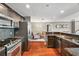 Stylish kitchen with stainless steel appliances, granite counters, and an open view to the living area at 345 Bayshore Blvd # 308, Tampa, FL 33606
