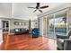 Open-concept living room boasts hardwood floors, modern decor, and a sliding glass door to the balcony at 345 Bayshore Blvd # 308, Tampa, FL 33606