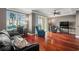 Inviting living room featuring hardwood floors, a ceiling fan, and a sliding glass door to a balcony at 345 Bayshore Blvd # 308, Tampa, FL 33606