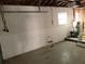 Unfinished garage with exposed framing and a cracked wall at 408 39Th Ave, St Pete Beach, FL 33706