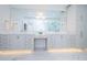 Modern bathroom featuring a double vanity and marble countertops at 455 Pinellas Bayway S # 3B, Tierra Verde, FL 33715