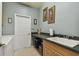 Bright laundry room with washer, dryer, and built-in cabinets at 5444 90Th Avenue E Cir, Parrish, FL 34219