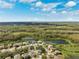 Aerial view of a residential neighborhood near a lake at 6003 Candytuft Pl, Land O Lakes, FL 34639