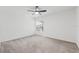 Bright bedroom featuring ceiling fan and carpeted floors at 6003 Candytuft Pl, Land O Lakes, FL 34639