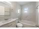 Modern bathroom featuring updated fixtures, a new shower, and a marble countertop at 615 W Virginia Ave, Tampa, FL 33603