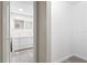 Bright bathroom featuring a dual sink vanity and large, lighted mirror at 615 W Virginia Ave, Tampa, FL 33603