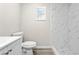 Modern bathroom featuring a white toilet, vanity and marble shower at 615 W Virginia Ave, Tampa, FL 33603