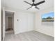 Bedroom with a modern ceiling fan, closet and luxury vinyl plank flooring at 615 W Virginia Ave, Tampa, FL 33603