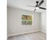 A bright bedroom with a modern ceiling fan and luxury vinyl plank flooring at 615 W Virginia Ave, Tampa, FL 33603