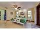 Bright bedroom featuring a leafy green comforter, ceiling fan, and lots of natural light at 7255 18Th Ne St, St Petersburg, FL 33702