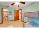 Cozy bedroom with bunk beds and a closet with shelving for books and games at 7255 18Th Ne St, St Petersburg, FL 33702