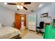 Bright bedroom with a ceiling fan, desk, and comfortable bed at 7255 18Th Ne St, St Petersburg, FL 33702